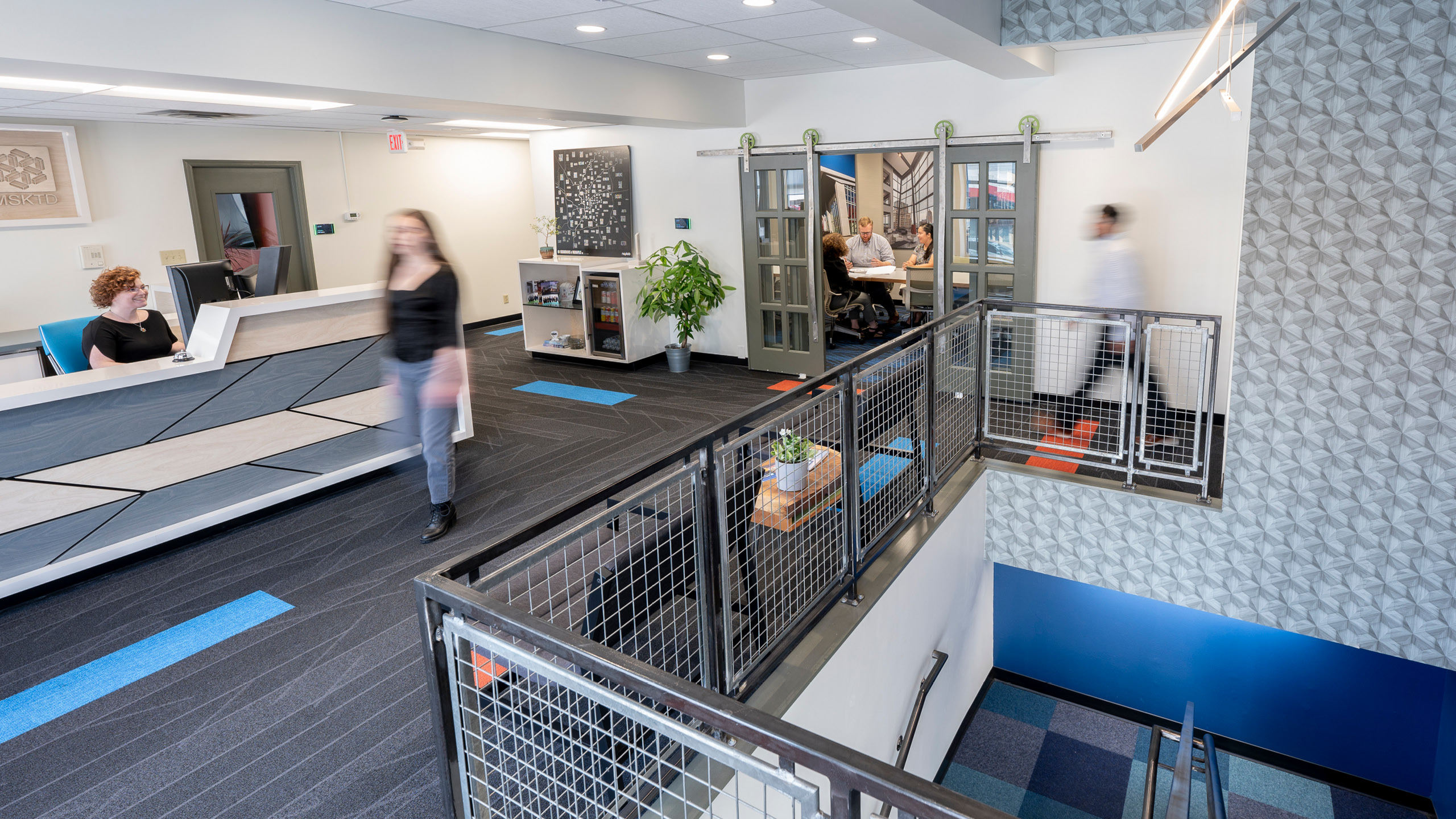 Person walking through the MSKTD Indianapolis office.