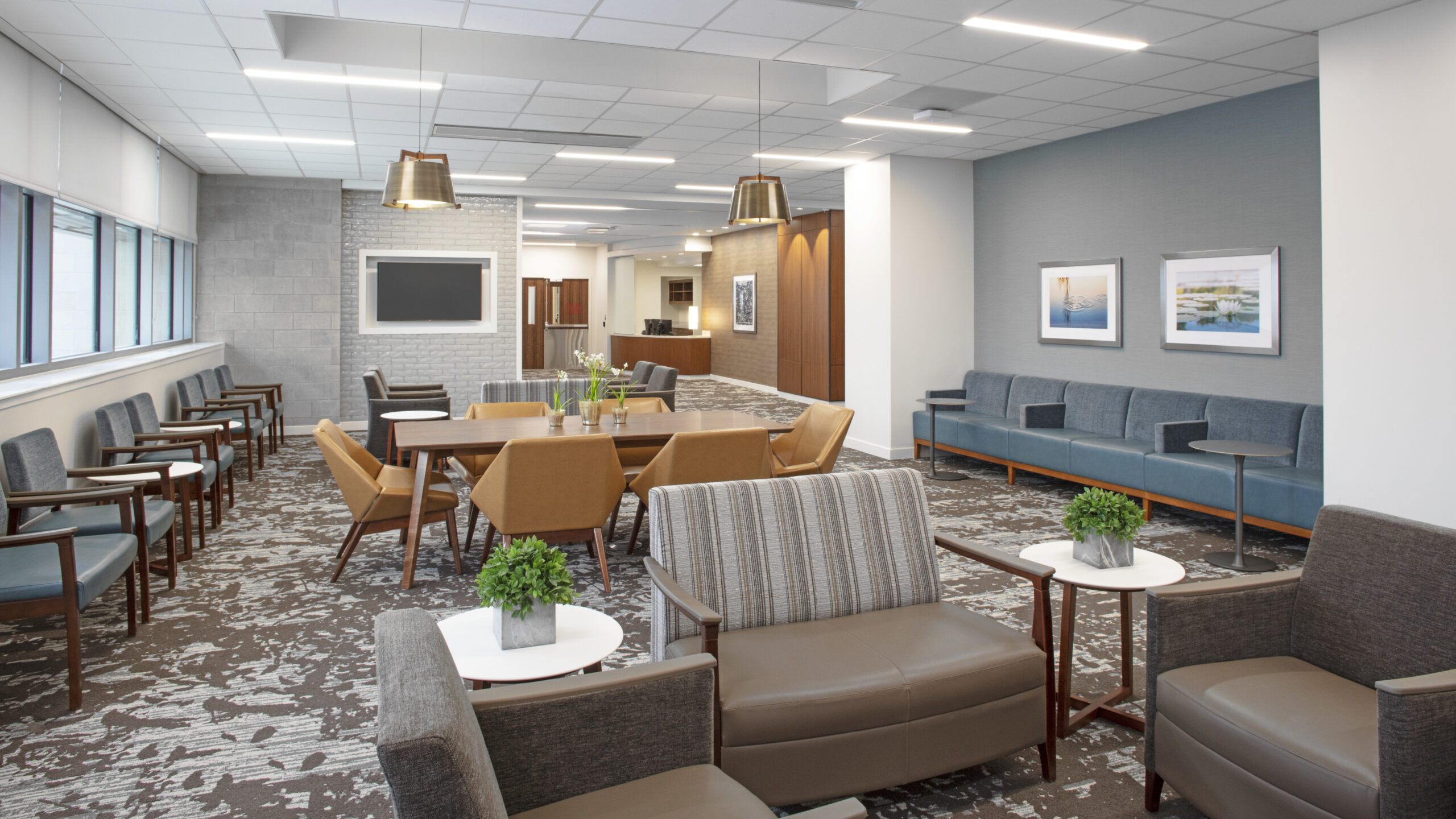 Guest or break area in a hospital with nice furniture and window views.