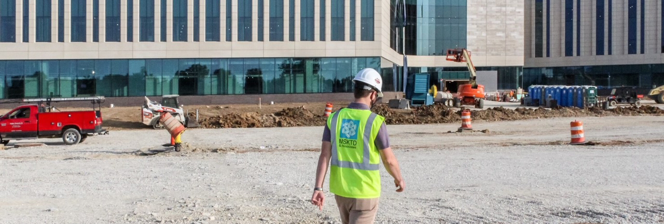 MSKTD associate walking on job site.